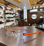 TAG Heuer rimless rectangular orange temple optical frame in the actual PrimePicks office
