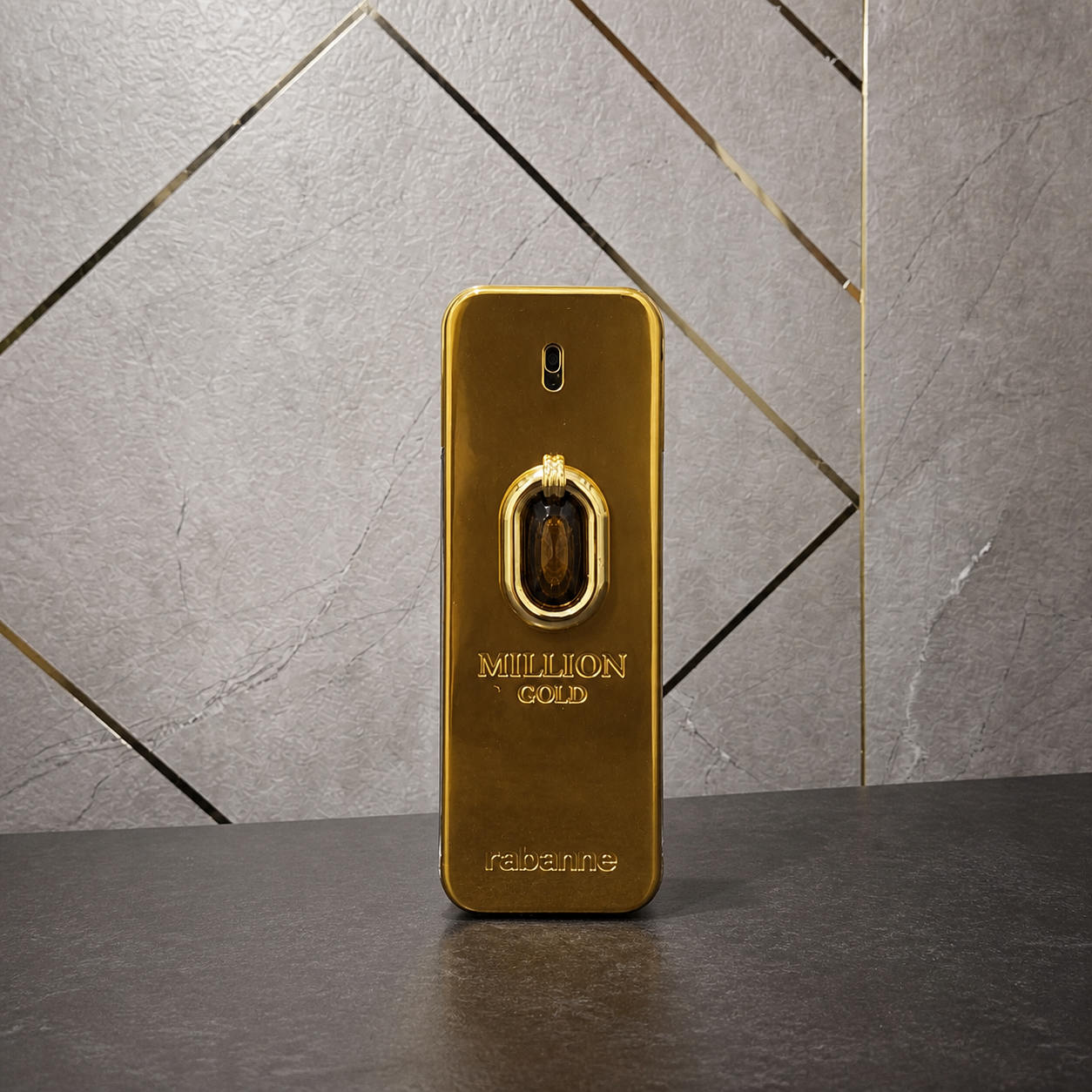 Rabanne Million Gold Elixir Parfum Intense bottle against the PrimePicks stone wall