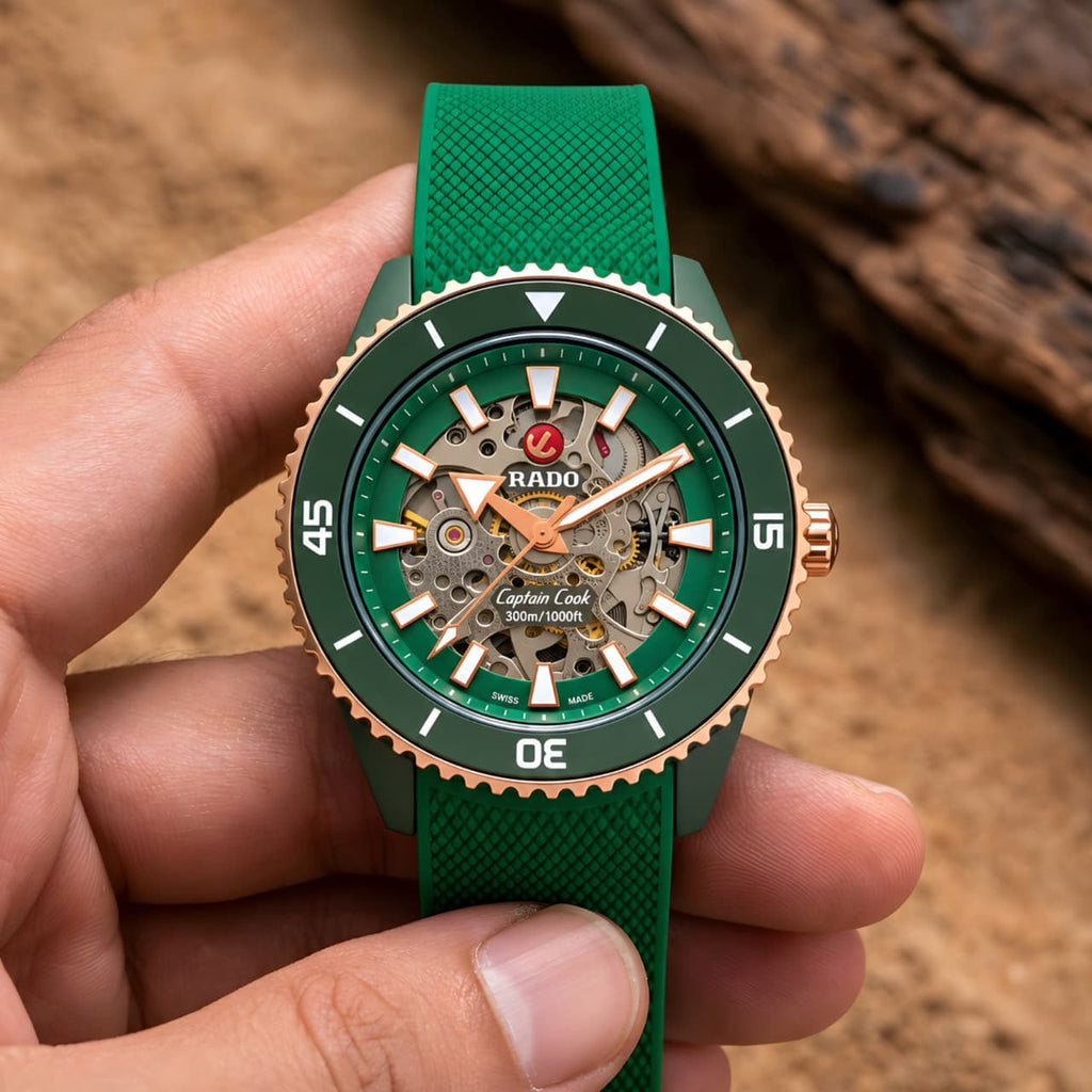 Close lifestyle view of the green and rose-gold Rado Captain Cook watch