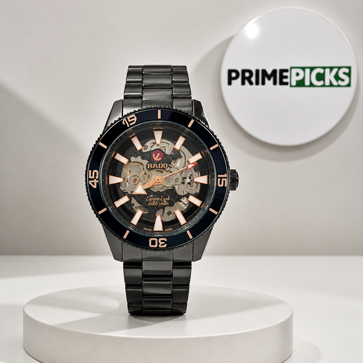 Rado Captain Cook automatic watch beside the round PrimePicks logo board