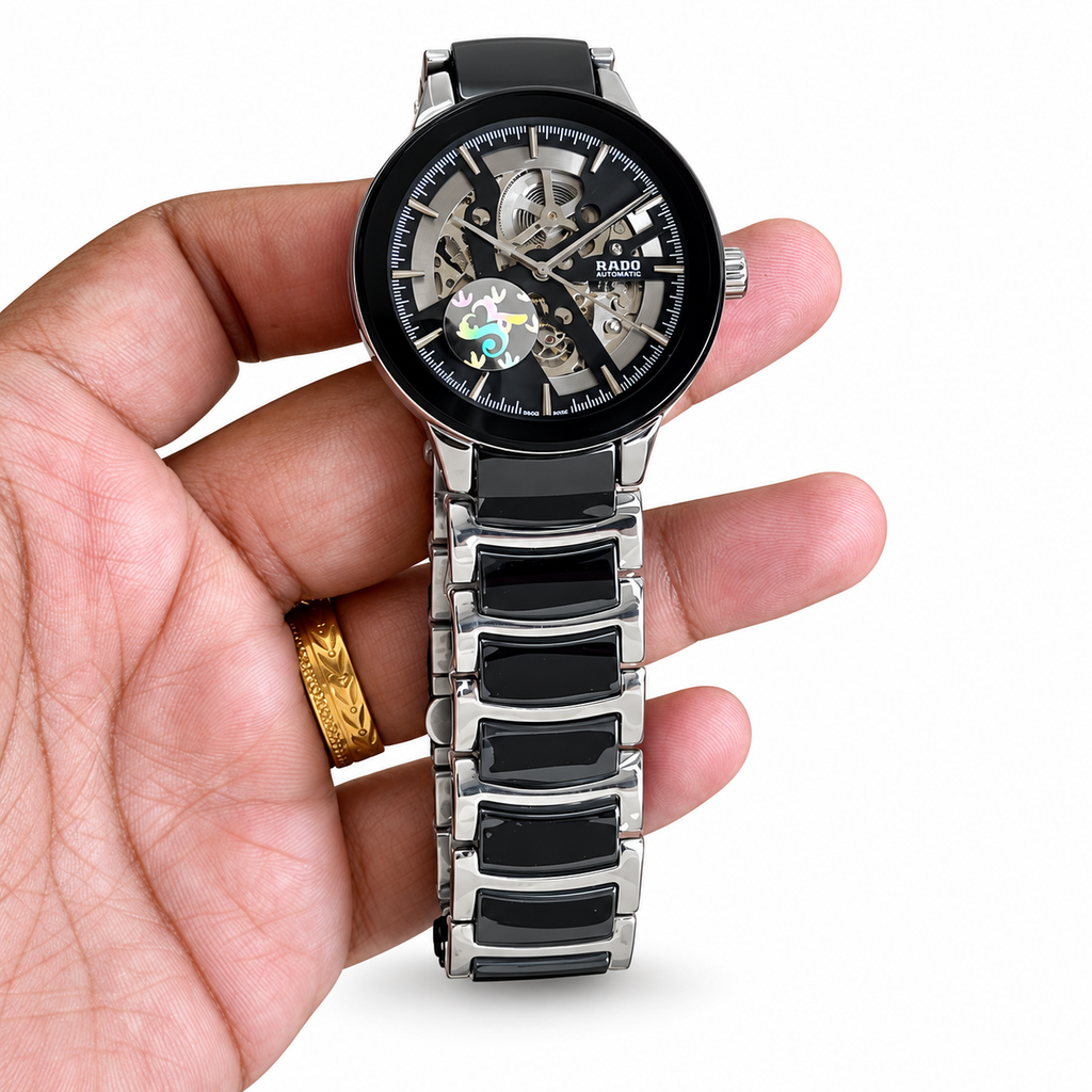 Rado Centrix Open Heart automatic watch in black and silver on white background
