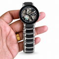 Rado Centrix Open Heart automatic watch in black and silver on white background
