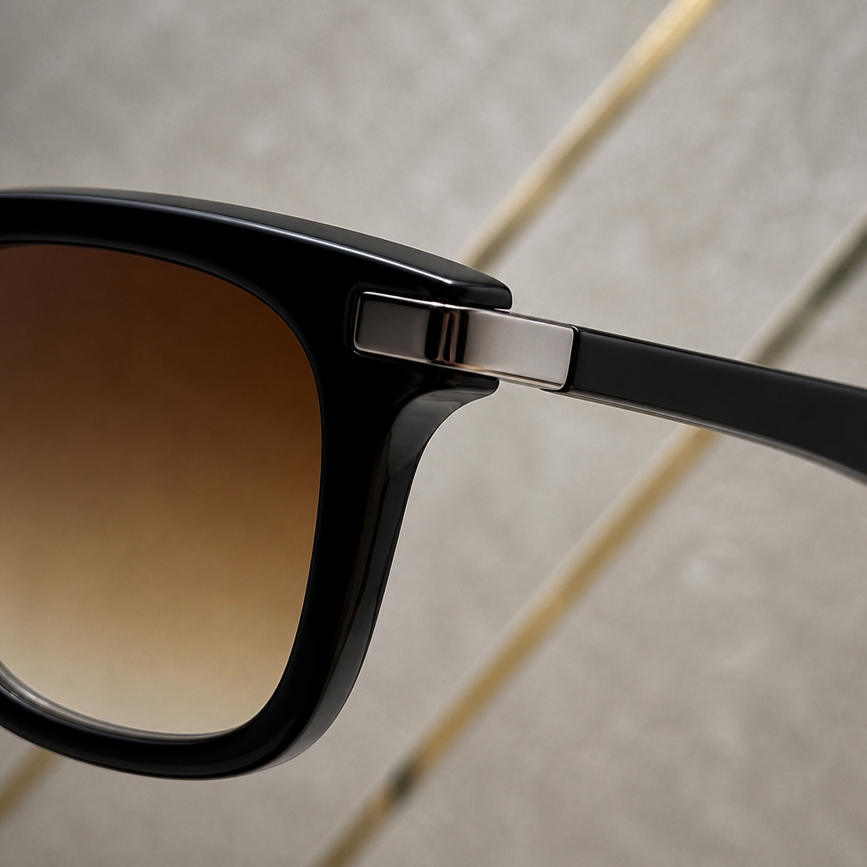 Ray-Ban Model 4287 Brown colour sunglasses silver-tone hinge and lens detail