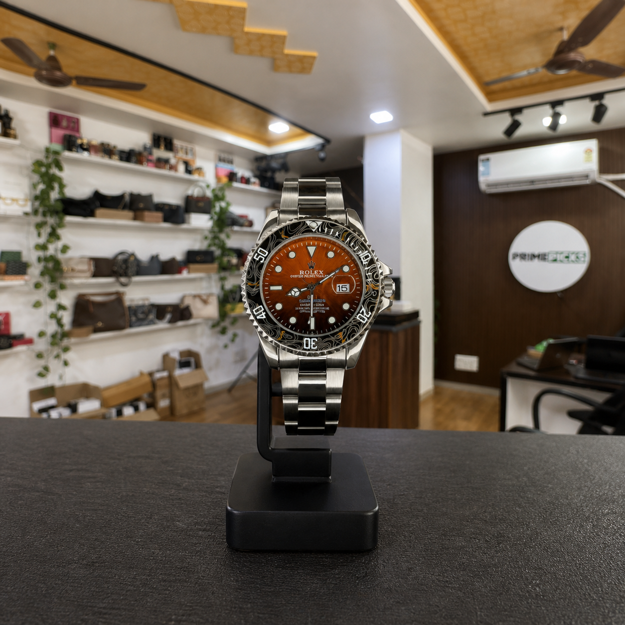 Rolex Submariner orange dial patterned bezel watch in Primepicks office