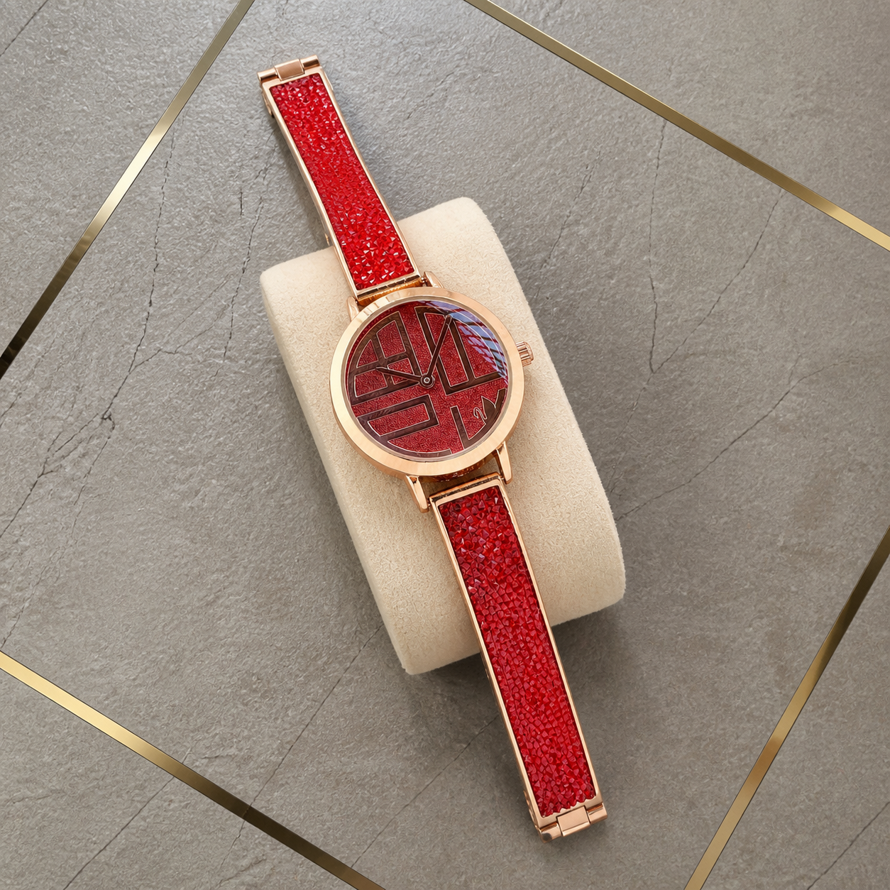 Swarovski Cosmic Rock red and rose gold tone women's watch flat lay at the Primepicks grey and gold office wall