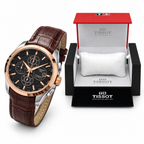 Rose-gold bezel black dial brown strap watch with matching OG box