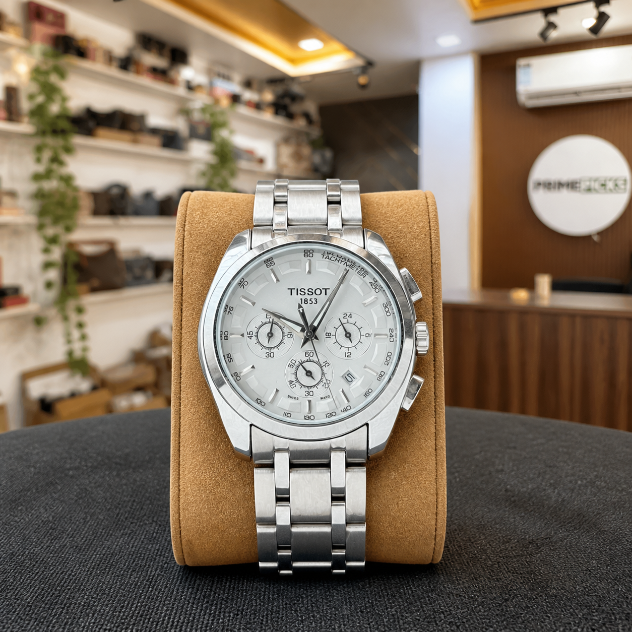 Tissot Couturier chronograph watch on tan display cushion