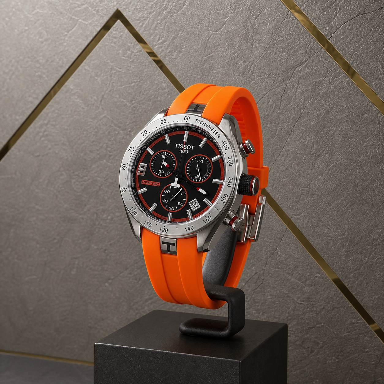 Tissot PRS 330 Tony Parker orange-strap watch against the grey and gold Primepicks office wall