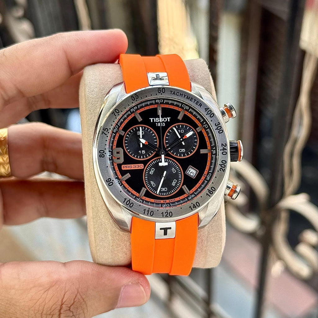 Tissot PRS 330 black chronograph dial and orange strap on cushion