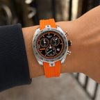 Tissot PRS 330 orange strap watch worn on wrist