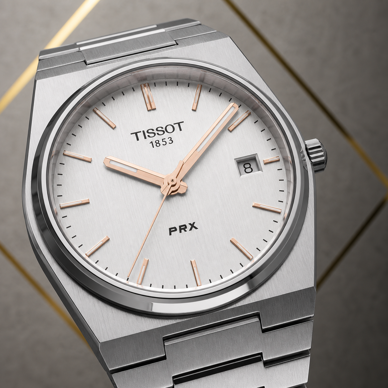 Tissot PRX watch silver dial, rose-gold-tone markers and date detail