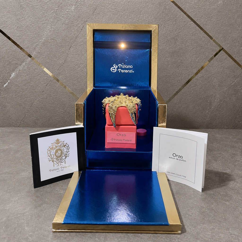 Tiziana Terenzi Orza Extrait de Parfum against the PrimePicks grey stone and gold wall