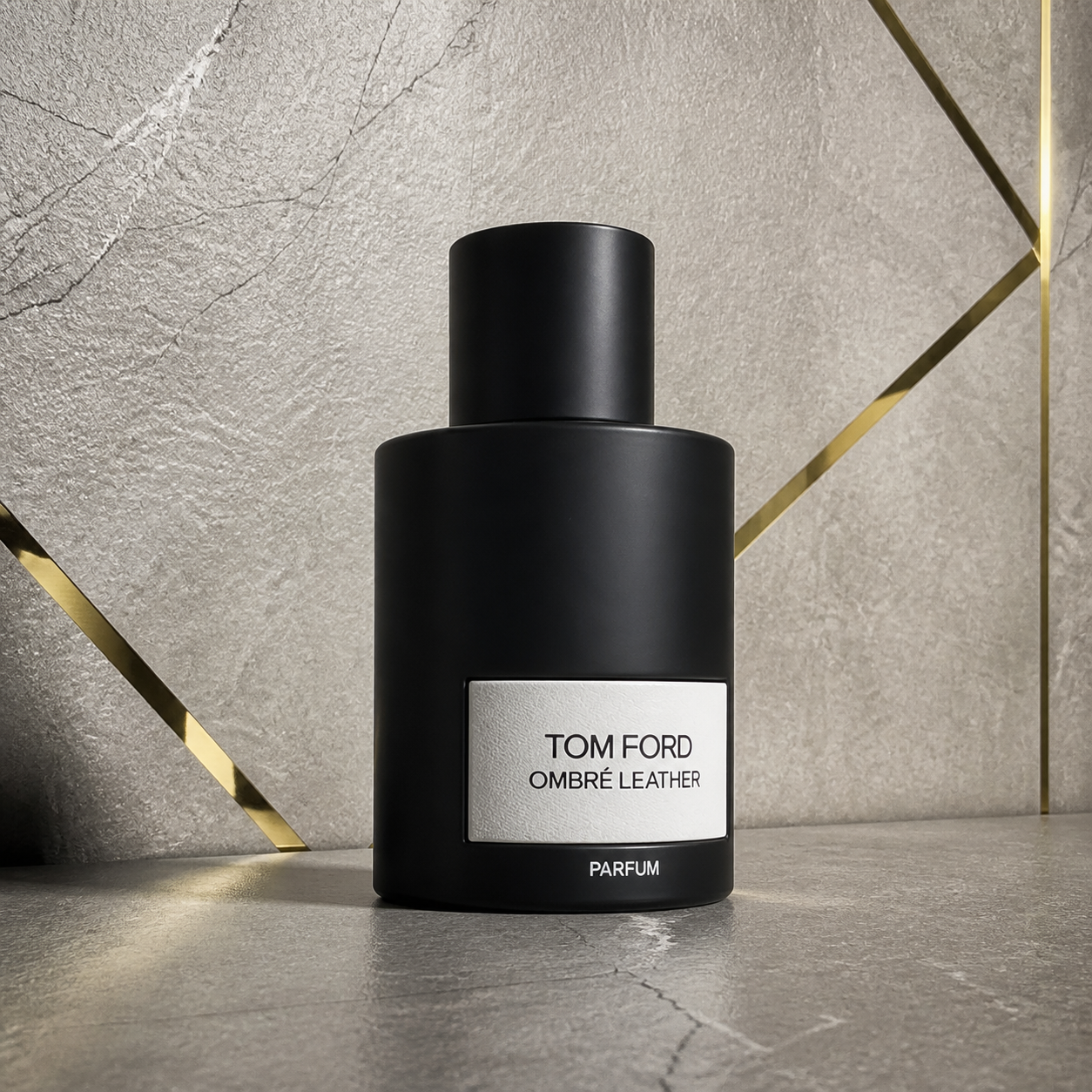 Tom Ford Ombré Leather Parfum bottle against the PrimePicks stone wall