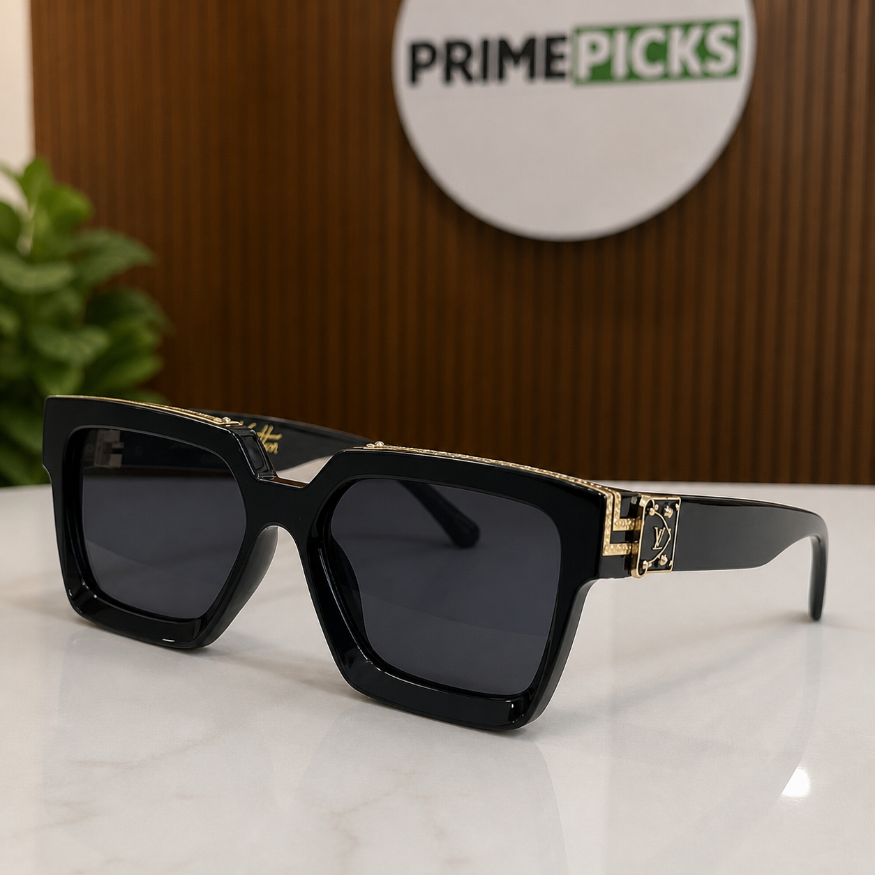 Louis Vuitton black angular square sunglasses with gold-tone accents and charcoal lenses, front three-quarter hero view