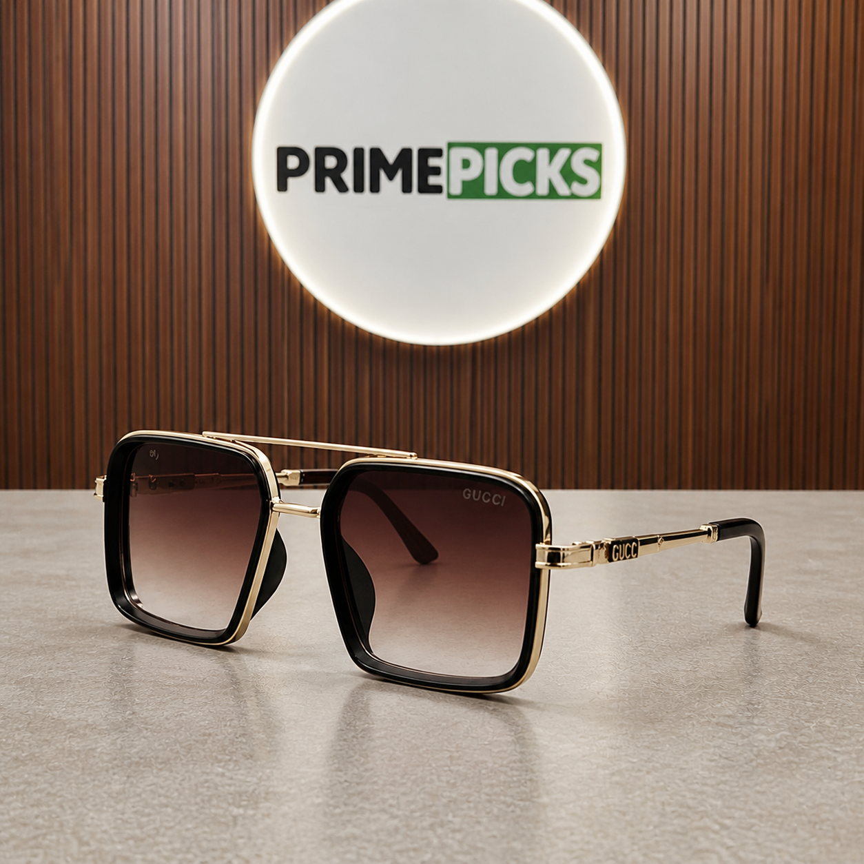 Gucci gold-and-black square double-bridge sunglasses with brown gradient lenses, alternate three-quarter view