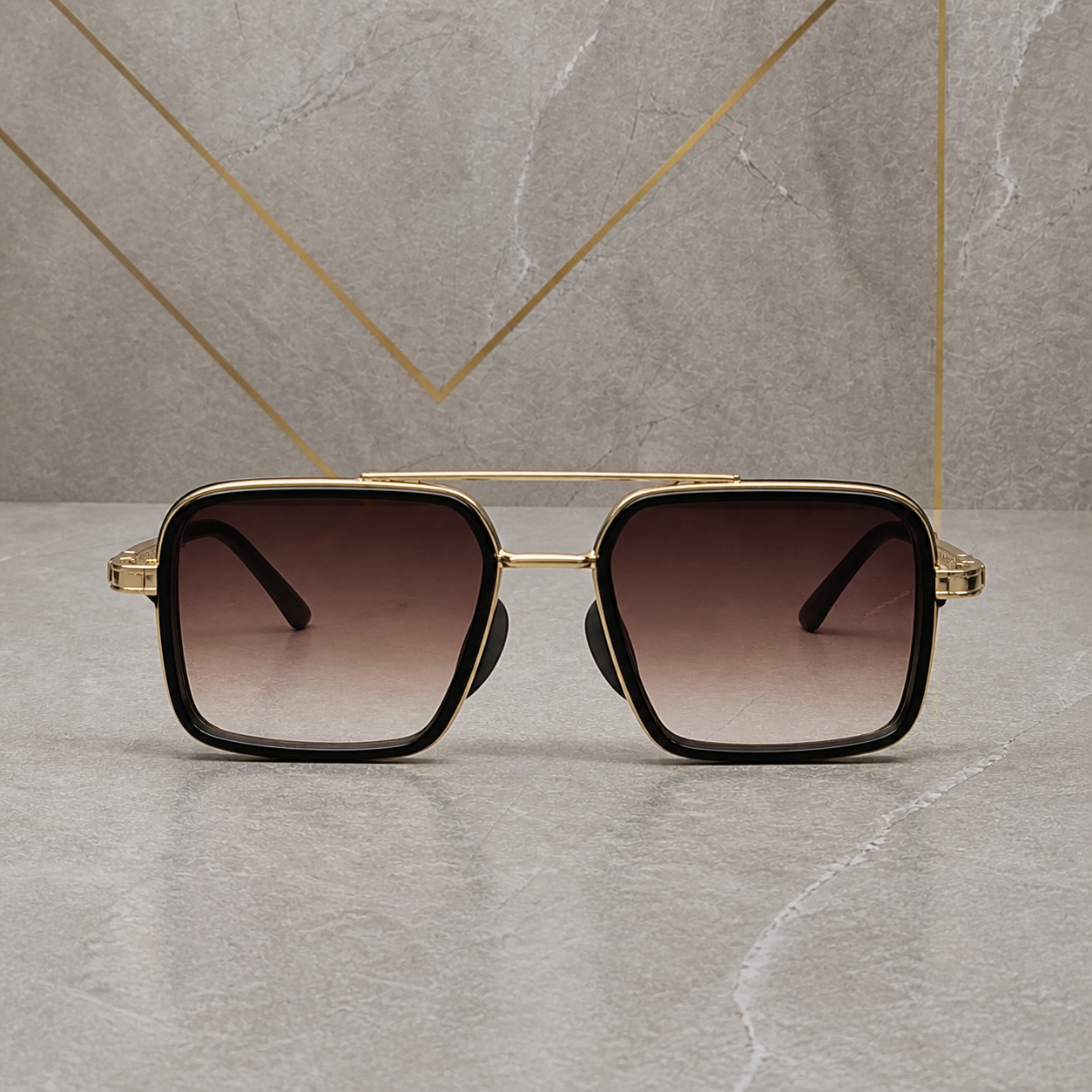 Gucci gold-and-black square double-bridge sunglasses with brown gradient lenses, elevated front view
