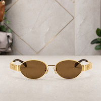 Celine gold-tone oval sunglasses with brown lenses, front view