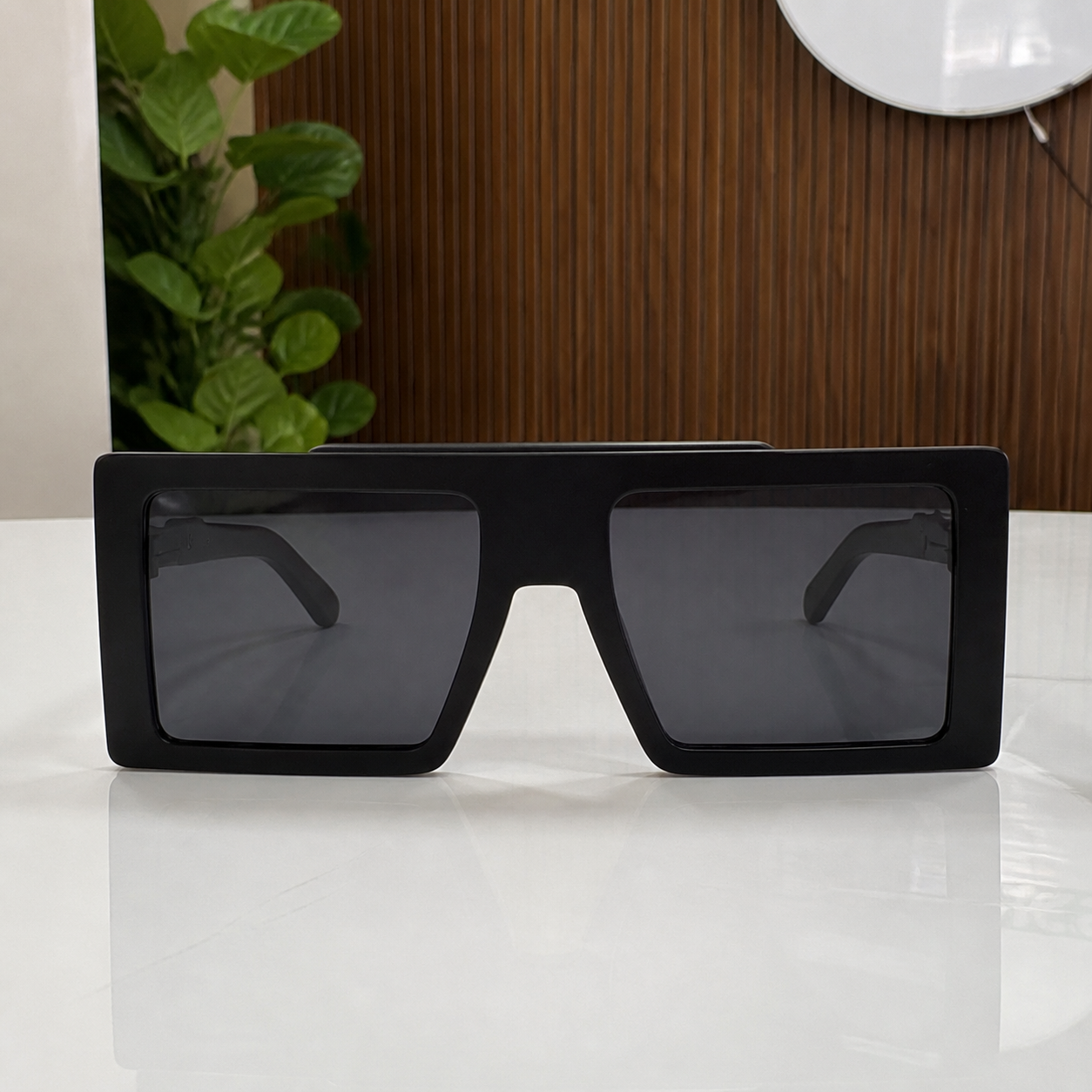 Marc Jacobs matte black oversized flat-top rectangular sunglasses with dark smoke lenses, elevated front view