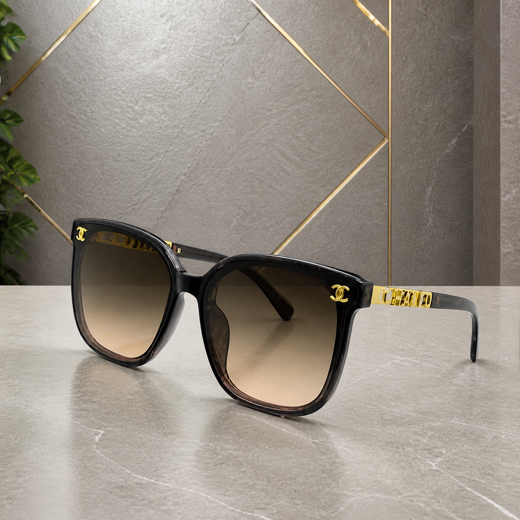 Chanel smoke-grey butterfly sunglasses with brown gradient lenses, front three-quarter hero view