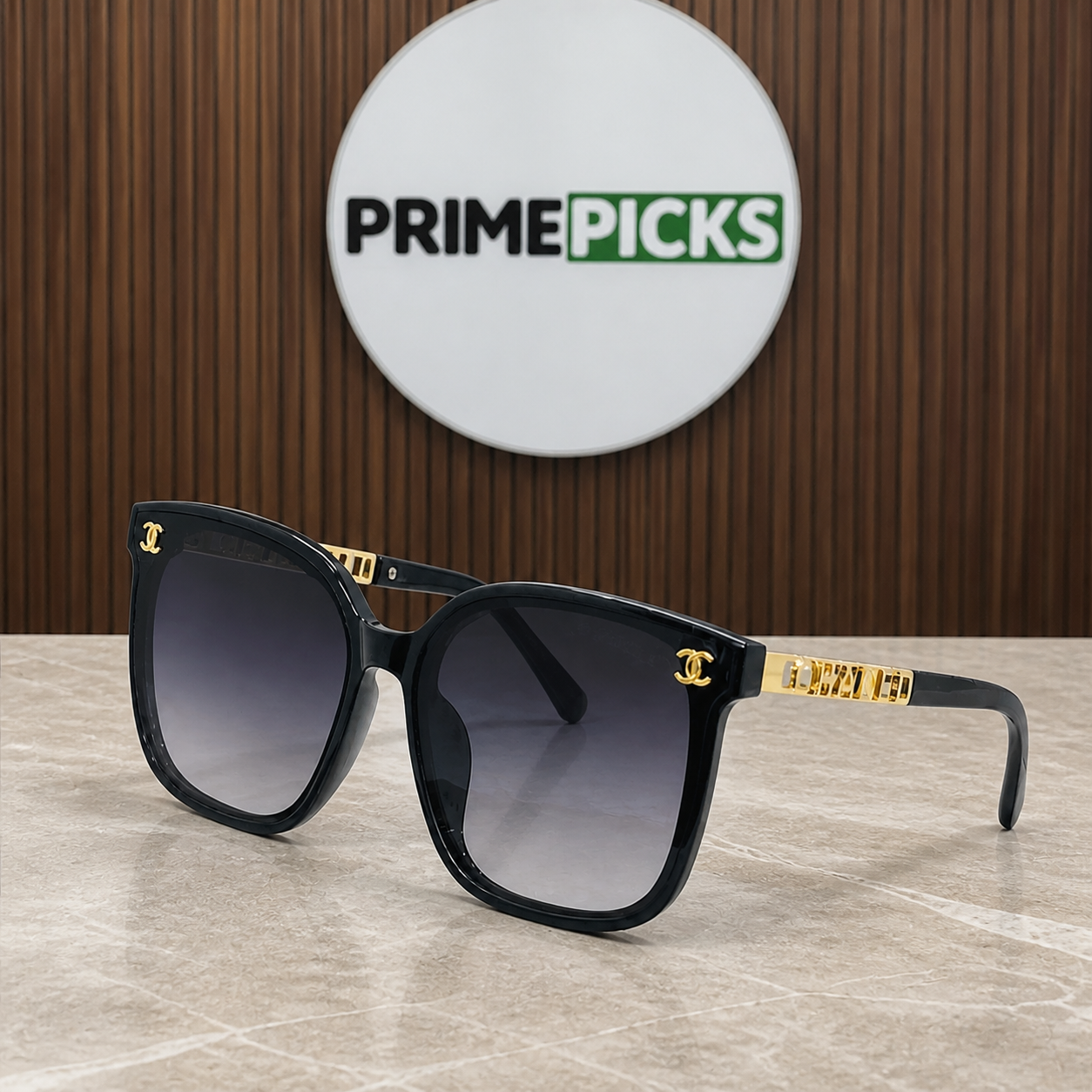 Chanel black butterfly sunglasses with smoke gradient lenses, alternate three-quarter view