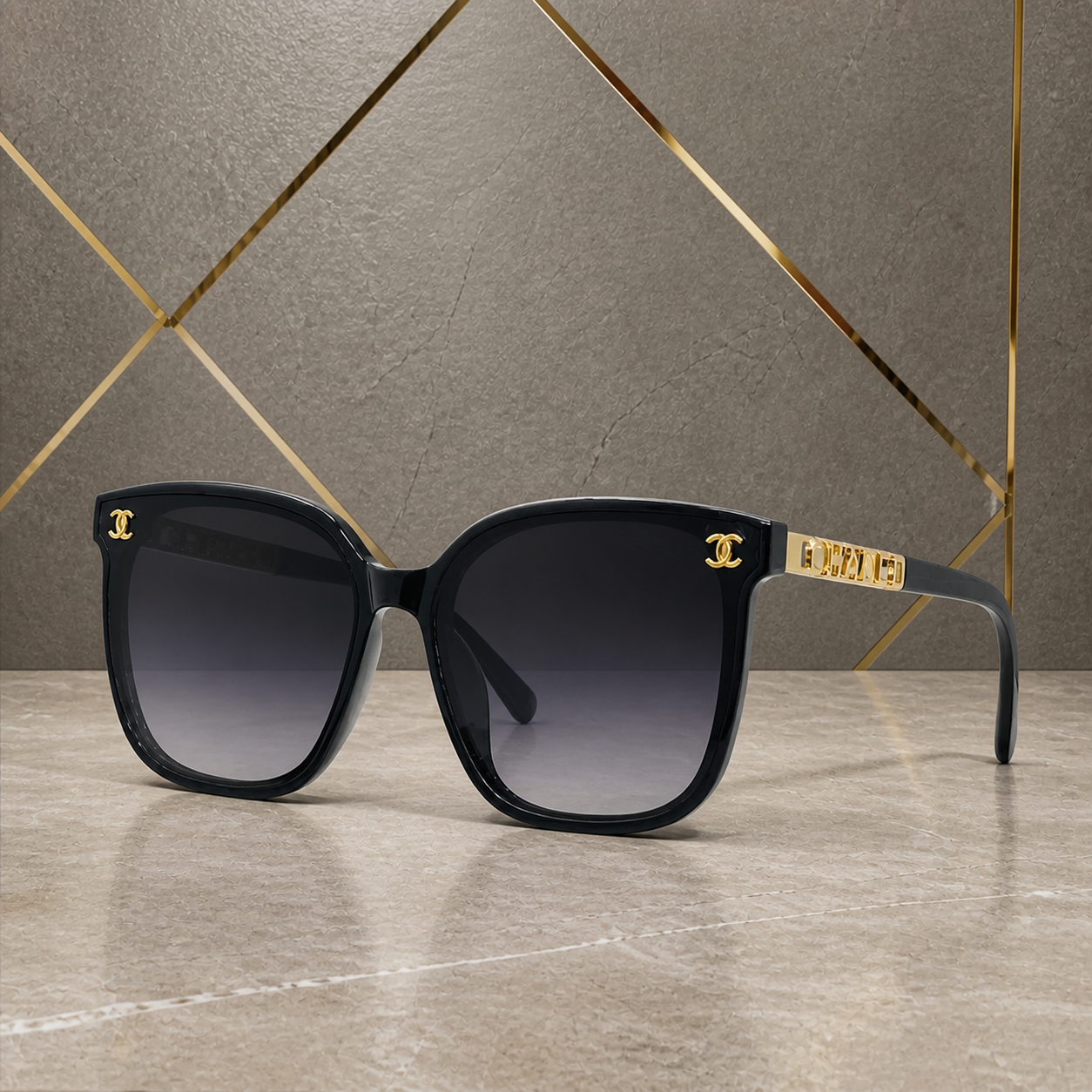Chanel black butterfly sunglasses with smoke gradient lenses, elevated front view