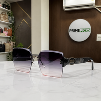Miu Miu black-temple oversized rimless square sunglasses with gunmetal-tone hardware and smoky mauve gradient lenses, front three-quarter hero view
