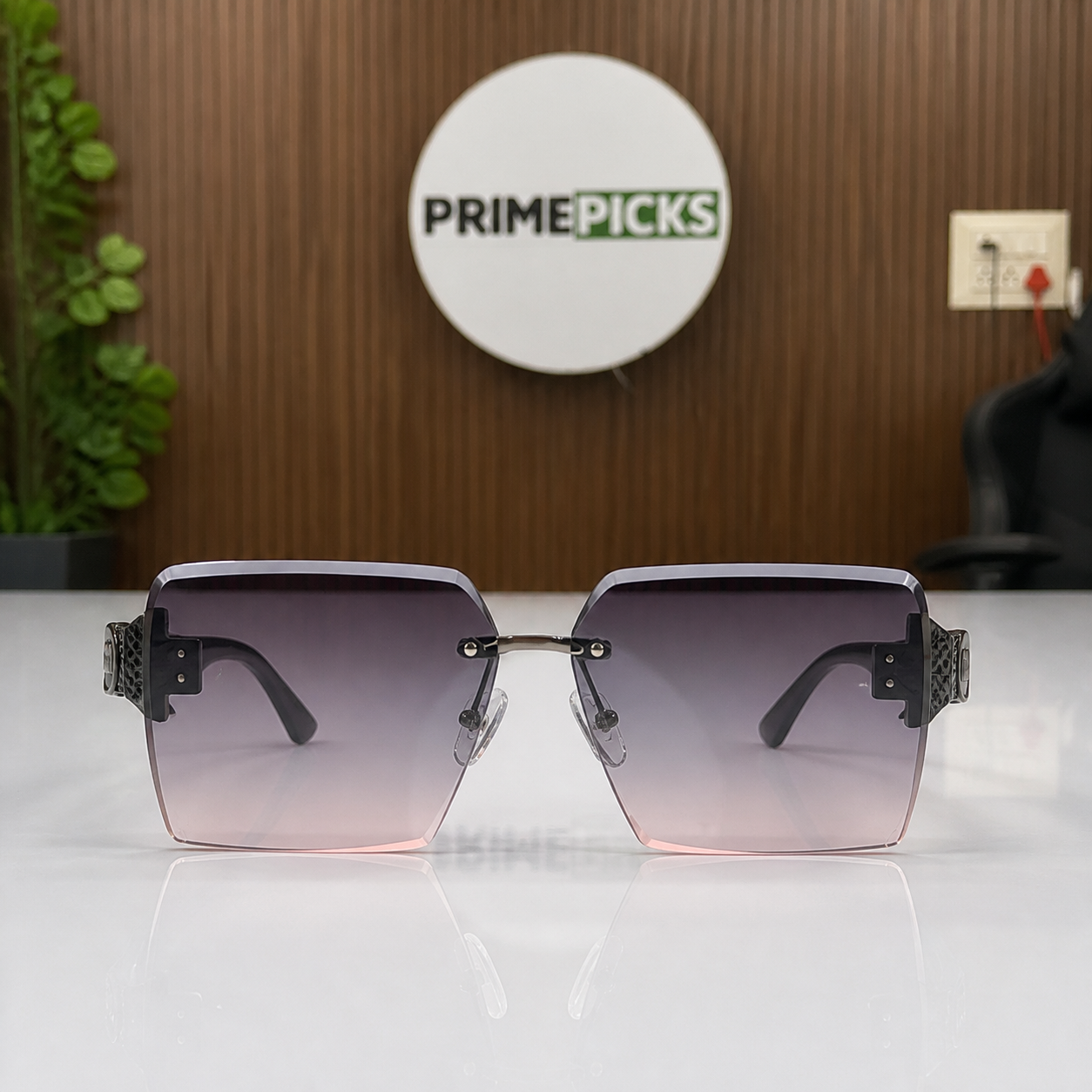 Miu Miu black-temple oversized rimless square sunglasses with gunmetal-tone hardware and smoky mauve gradient lenses, elevated front view