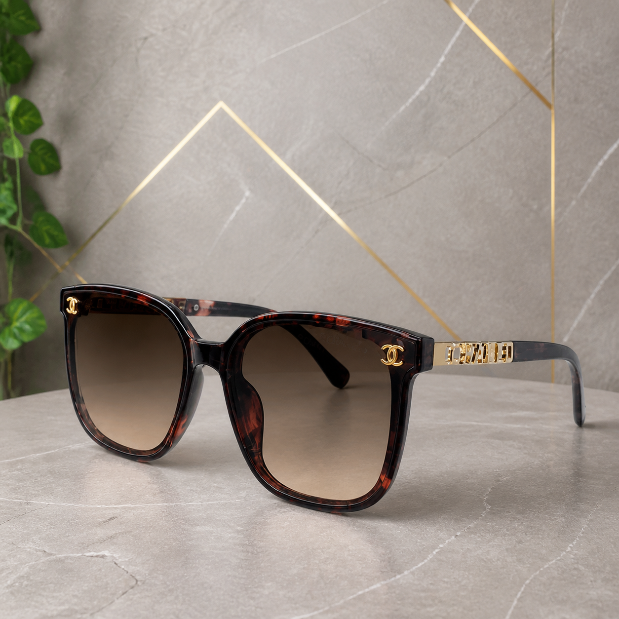 Chanel burgundy tortoiseshell butterfly sunglasses with brown gradient lenses, front three-quarter hero view