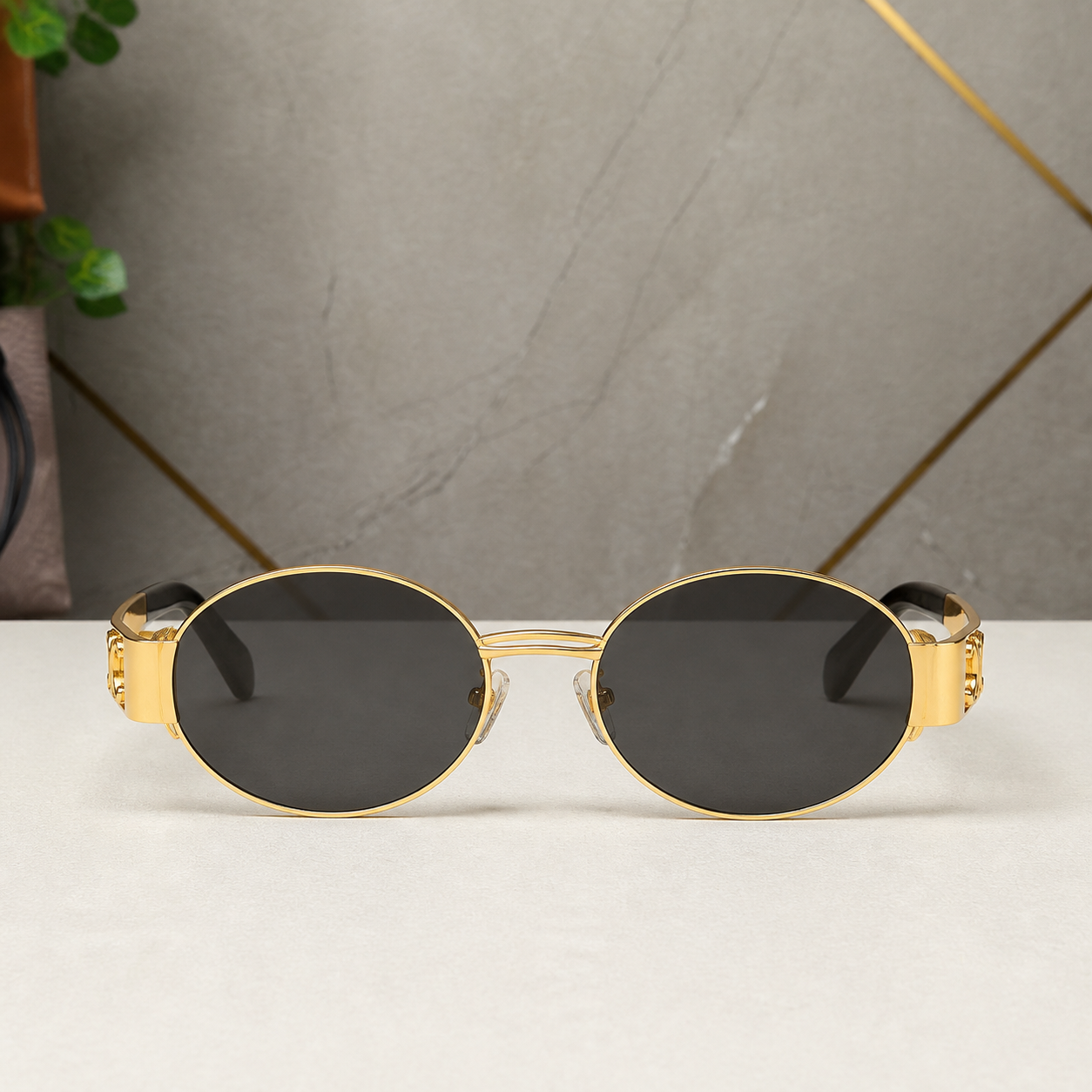 Celine gold-tone oval sunglasses with smoke lenses, front view