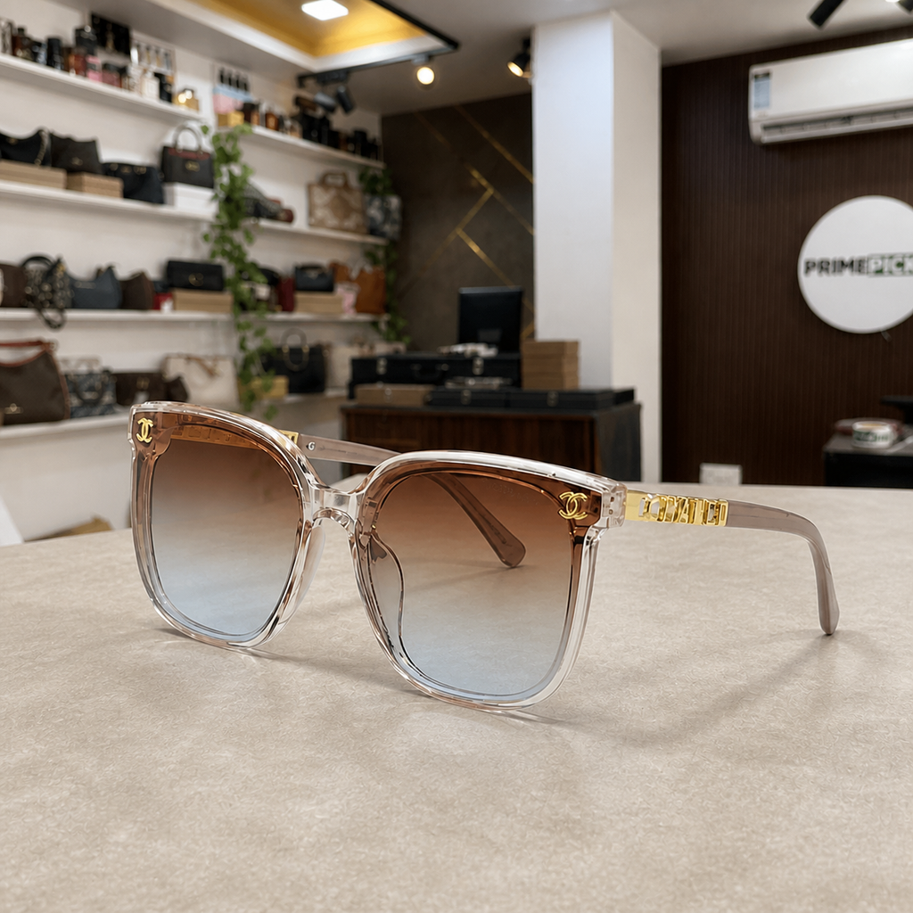 Chanel crystal-blush butterfly sunglasses with brown gradient lenses, PrimePicks office lifestyle view