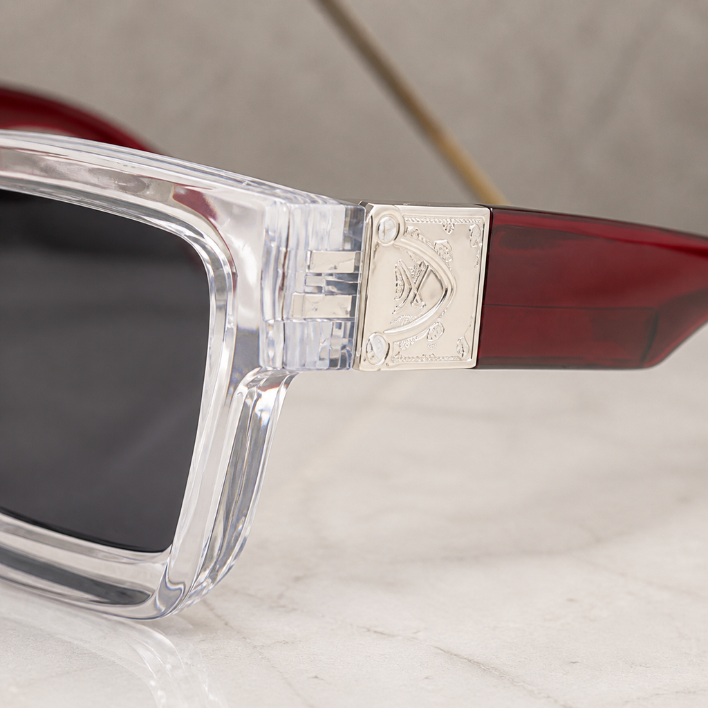 Louis Vuitton crystal angular square sunglasses with burgundy temples and smoke lenses, decorative hinge detail