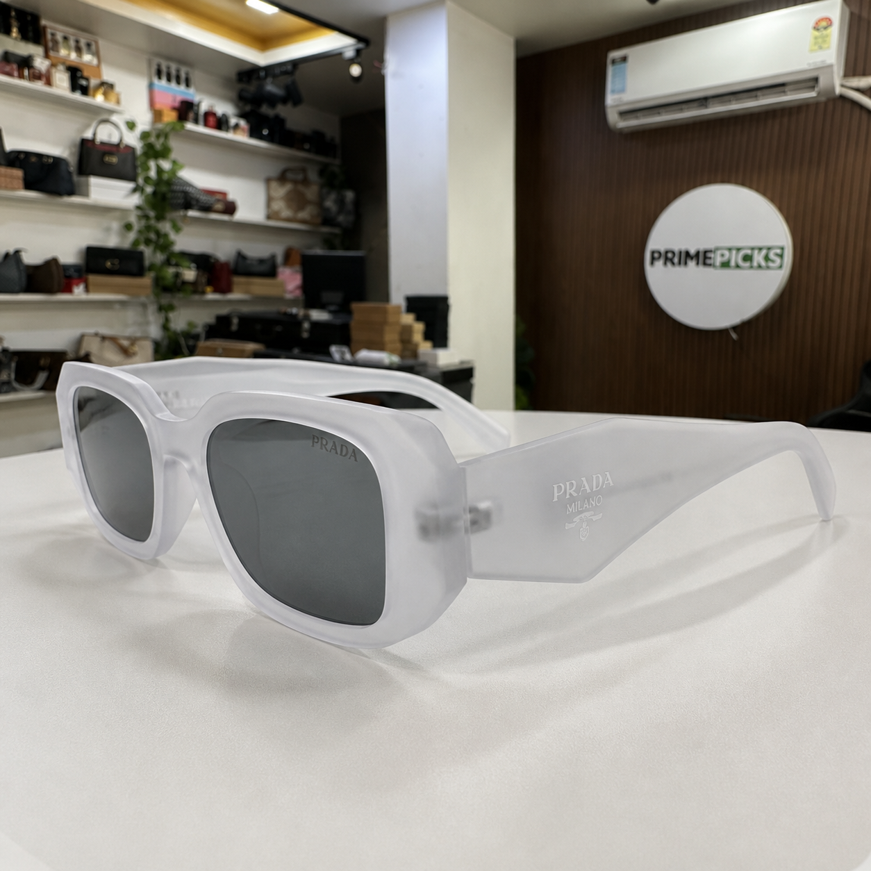 Prada Frosted White and Grey Smoke sunglasses - temple detail