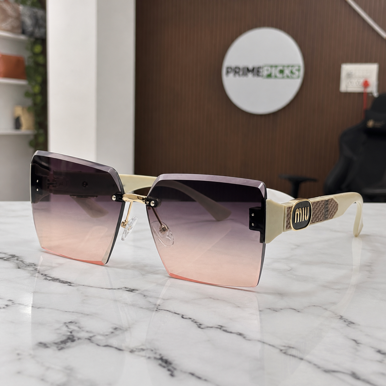 Miu Miu ivory-temple oversized rimless square sunglasses with gold-tone hardware and brown-to-rose gradient lenses, front three-quarter hero view