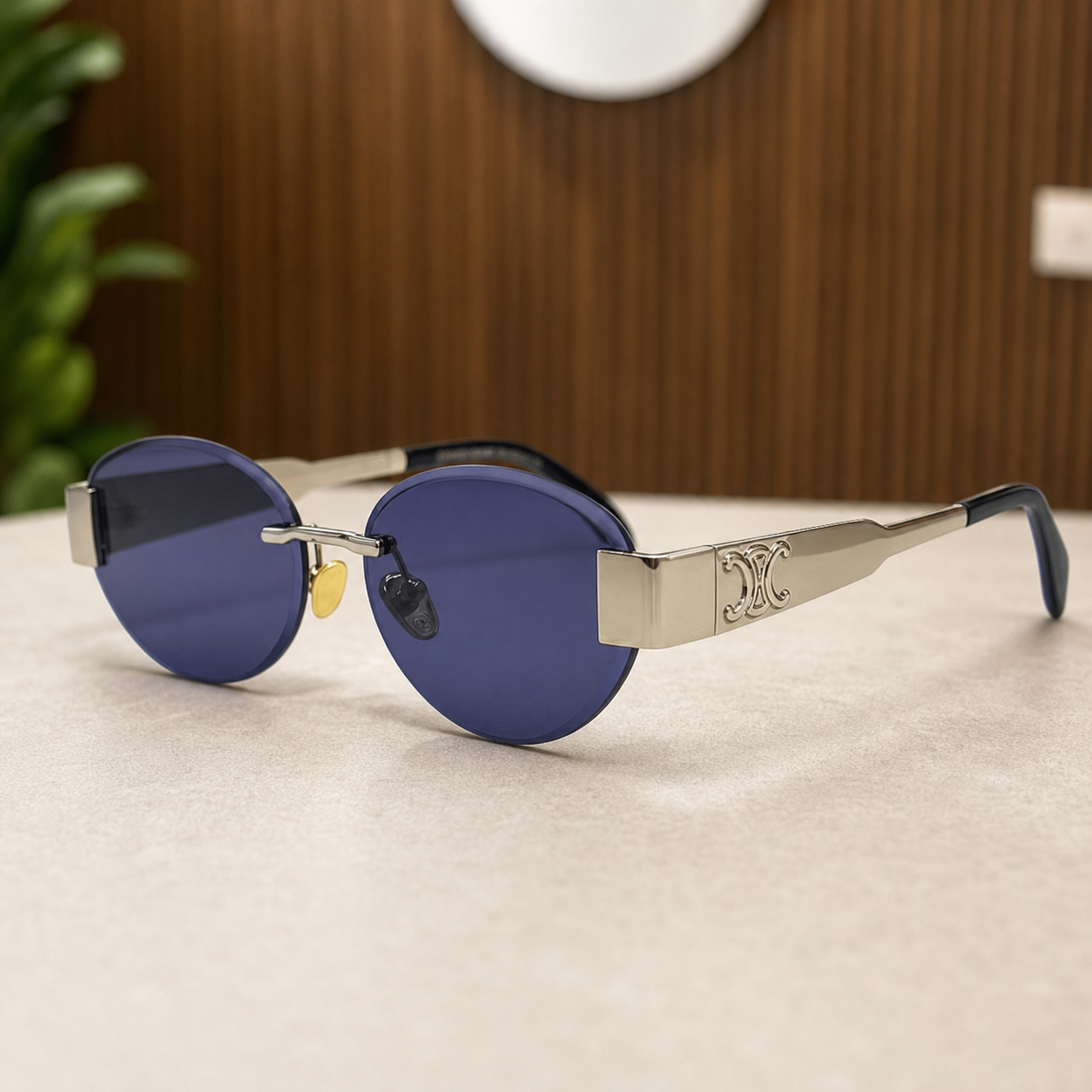 Celine silver-tone rimless round sunglasses with blue-violet lenses, ornate hinge detail