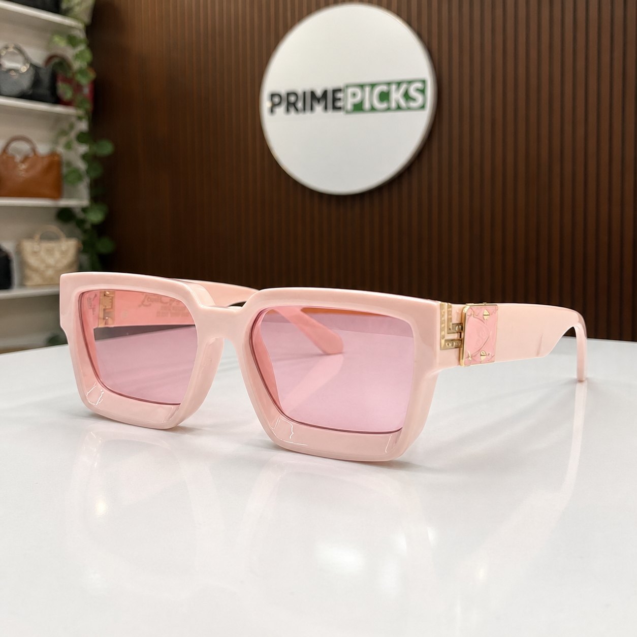Louis Vuitton blush pink angular square sunglasses with pink lenses, front three-quarter hero view