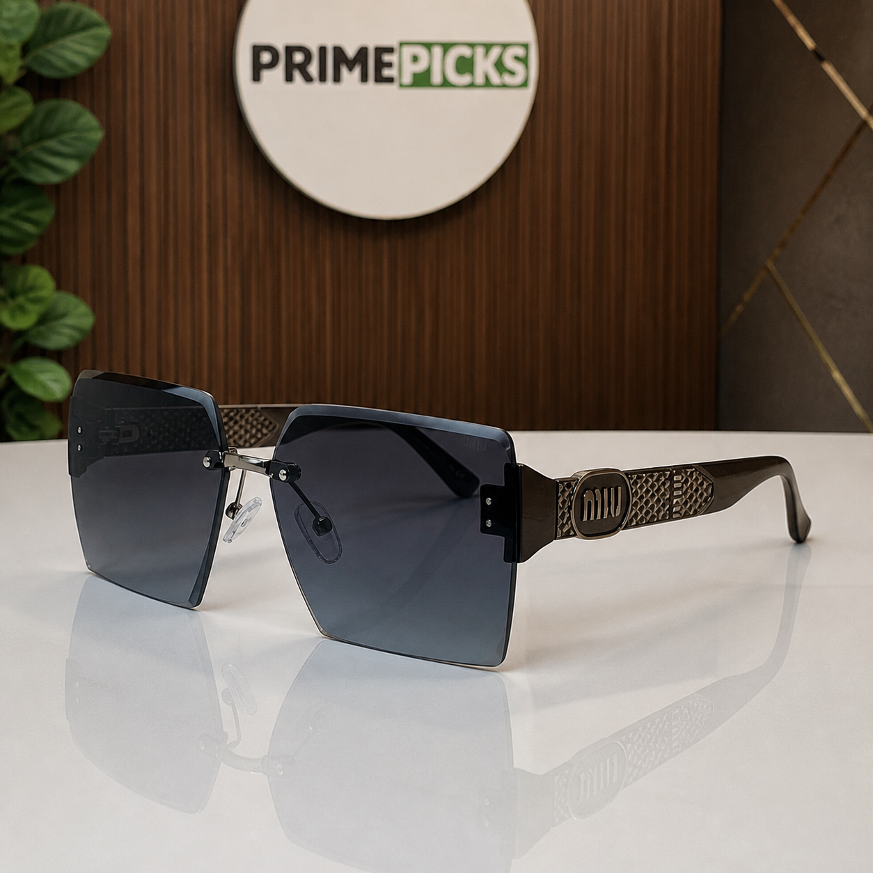 Miu Miu dark brown-temple oversized rimless square sunglasses with gunmetal-tone hardware and dark smoke-blue gradient lenses, alternate three-quarter view
