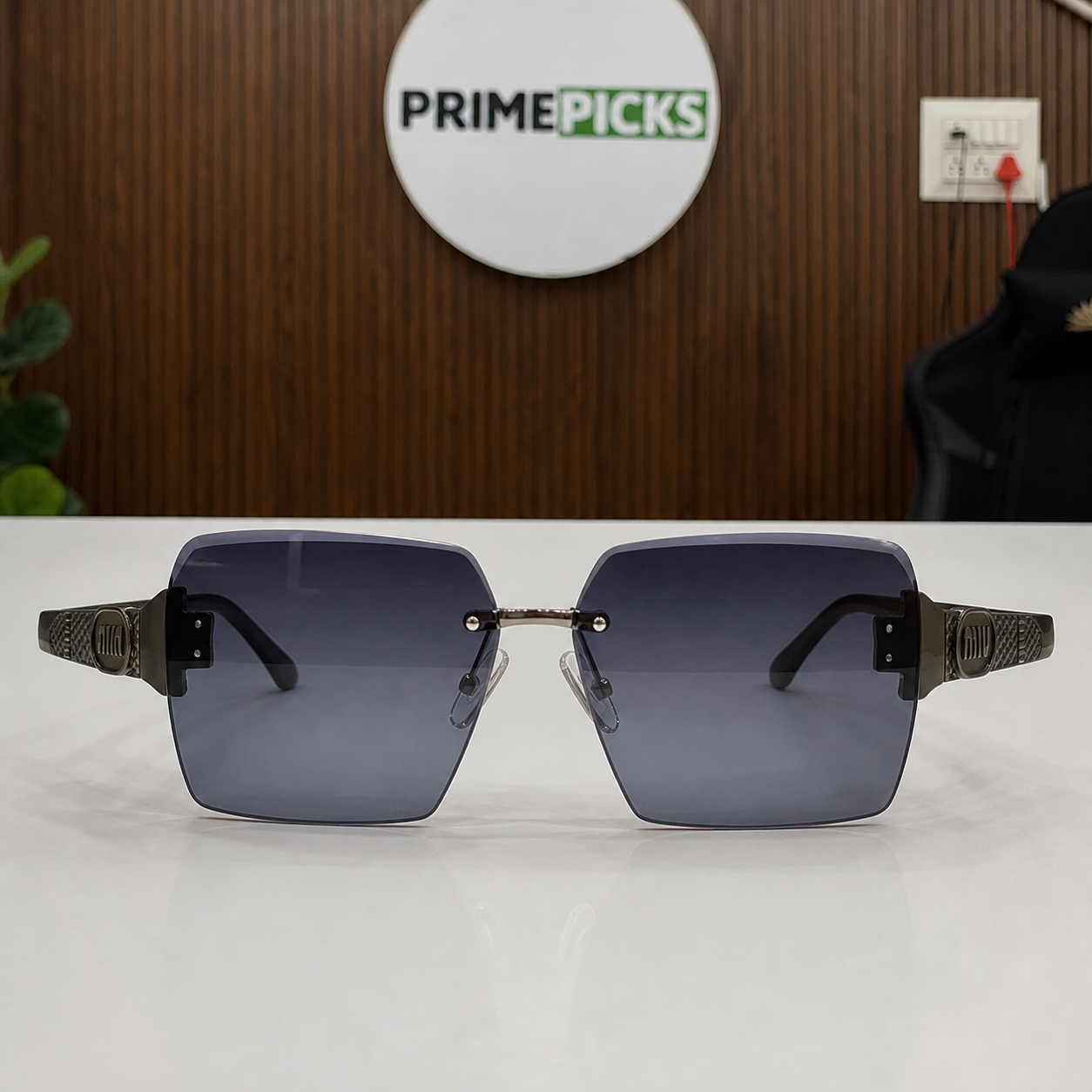 Miu Miu dark brown-temple oversized rimless square sunglasses with gunmetal-tone hardware and dark smoke-blue gradient lenses, elevated front view