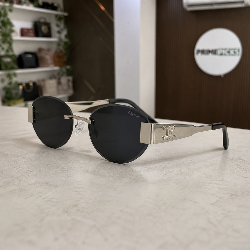 Celine silver-tone rimless round sunglasses with smoke lenses, three-quarter right view