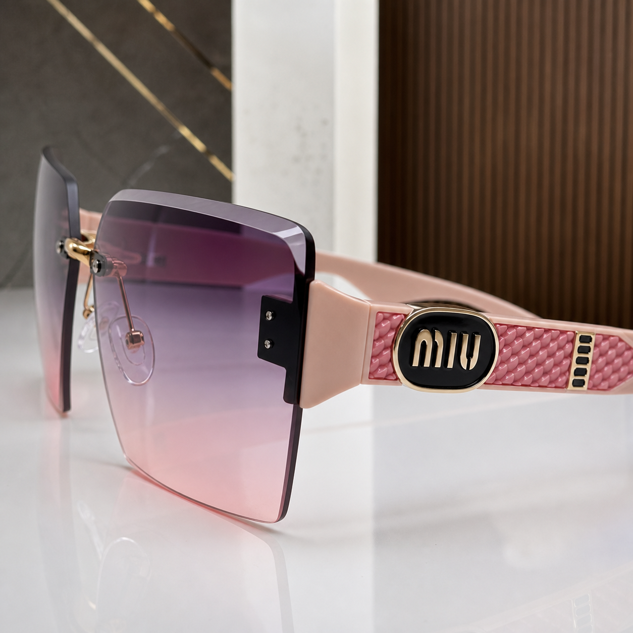 Miu Miu blush pink-temple oversized rimless square sunglasses with gold-tone hardware and violet-to-rose gradient lenses, temple medallion and textured panel detail