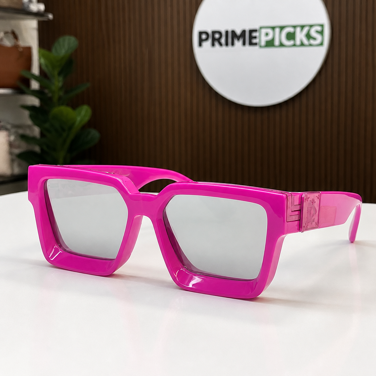 Louis Vuitton fuchsia angular square sunglasses with silver-grey lenses, front three-quarter hero view