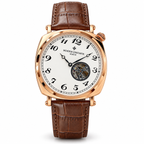 Vacheron Constantin open-heart men’s watch in rose gold with white dial and brown strap on white background