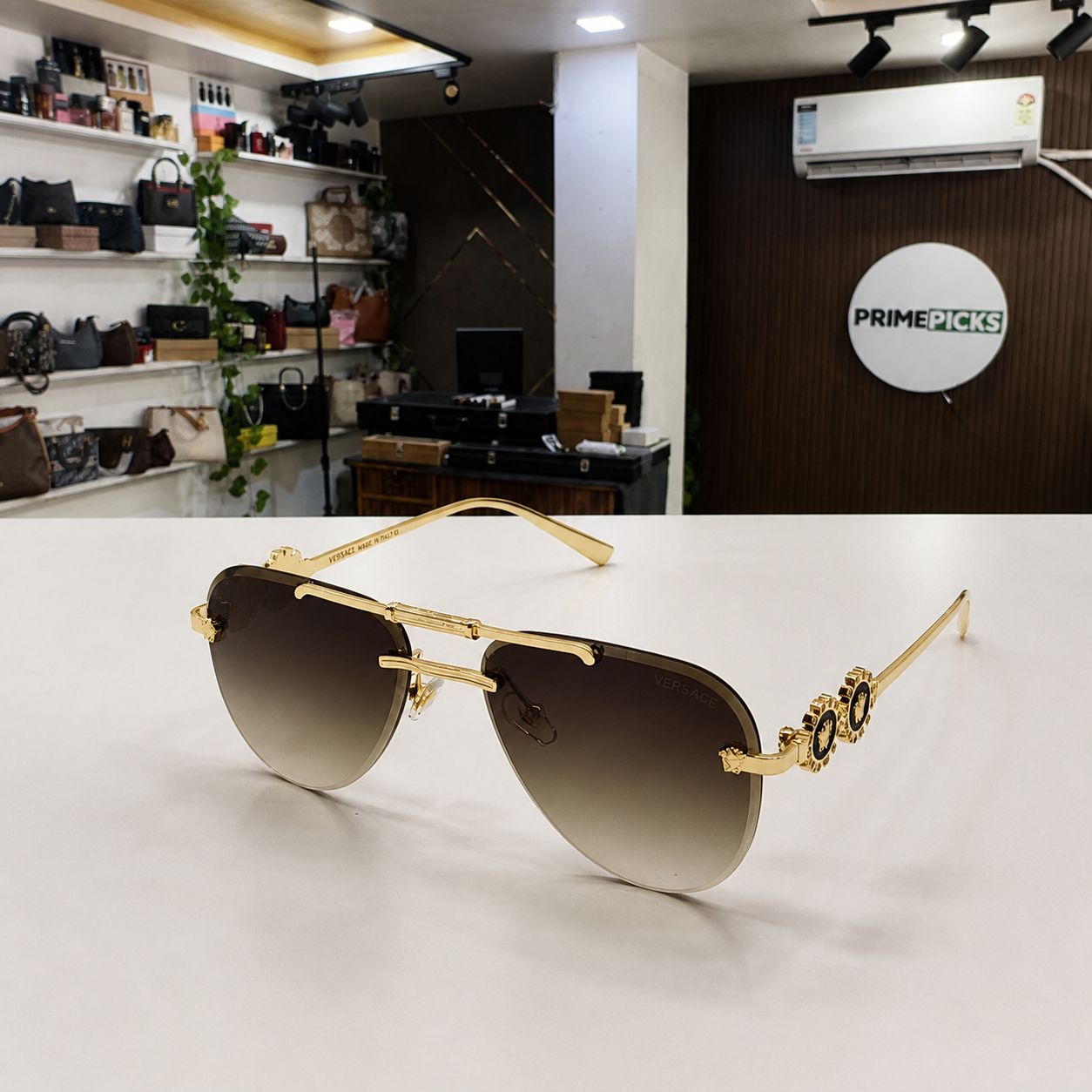 Versace medallion aviator sunglasses in gold and brown gradient, alternate angle