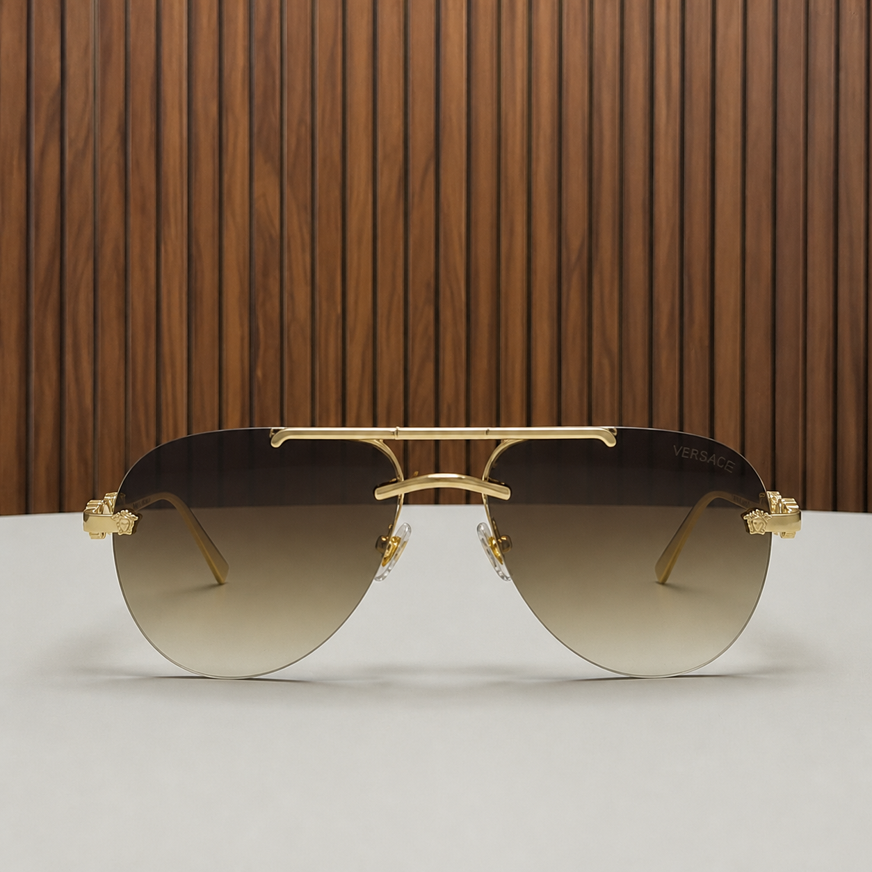 Versace medallion aviator sunglasses in gold and brown gradient, front view