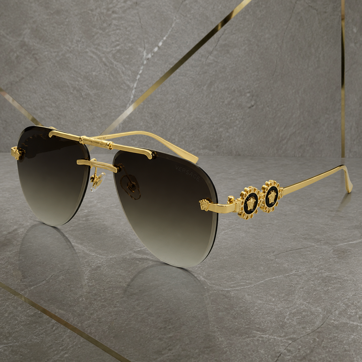 Versace medallion aviator sunglasses in gold and brown gradient, temple detail
