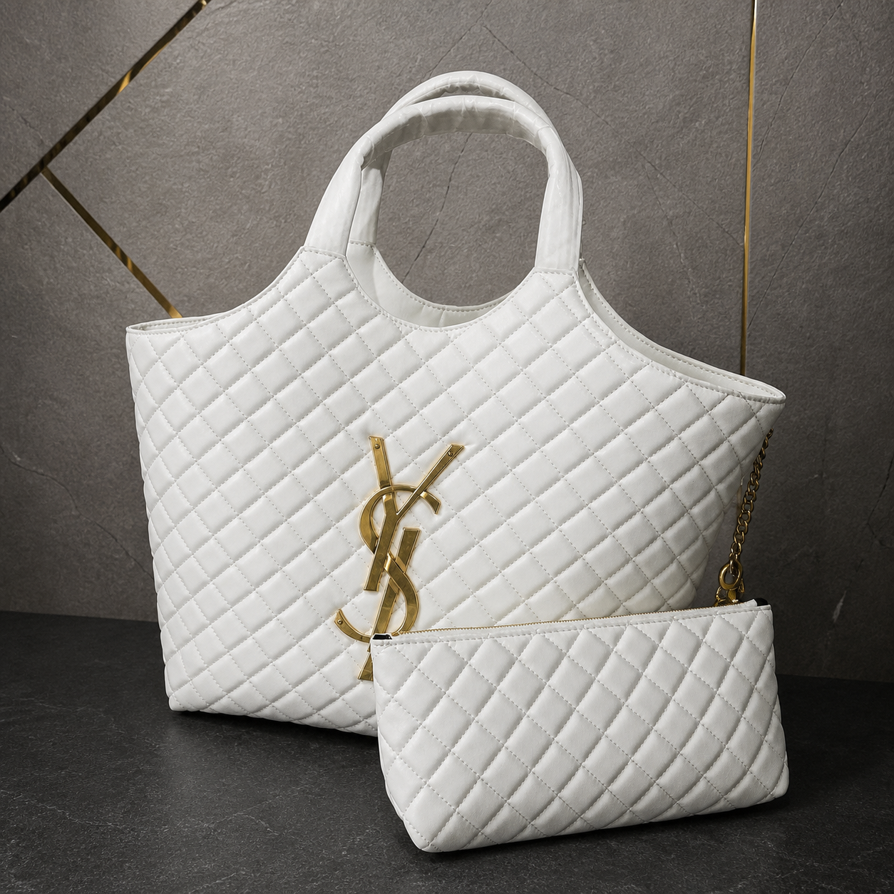 YSL Icare Maxi Tote close-up with gold-tone monogram and matching pouch