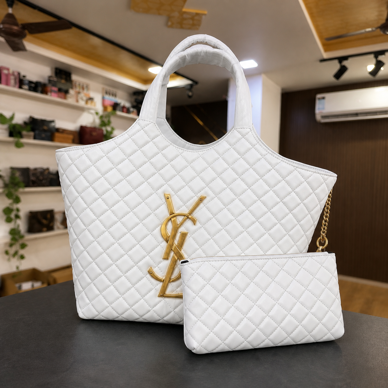 White YSL Icare Maxi Tote front view in Primepicks office