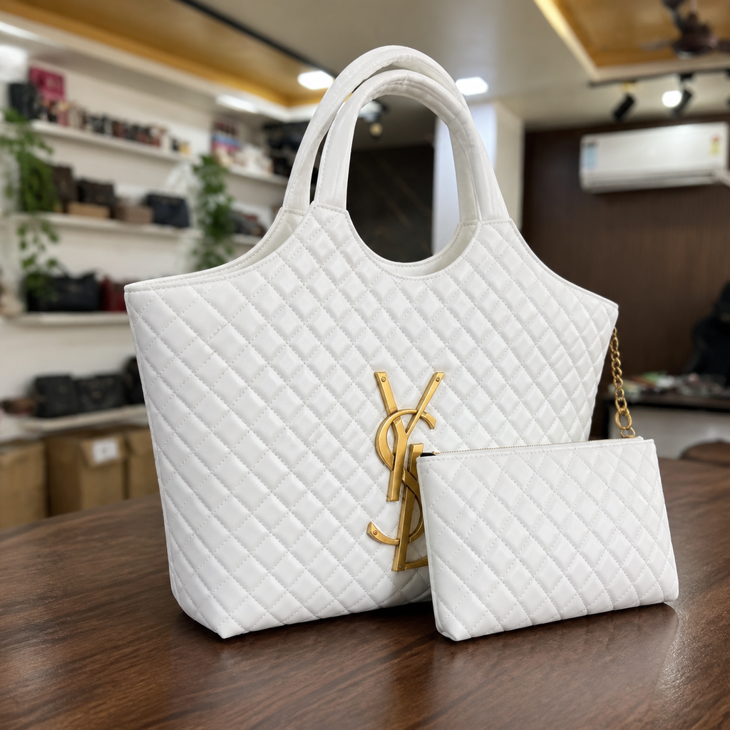 White quilted YSL Icare Maxi Tote three-quarter view with pouch