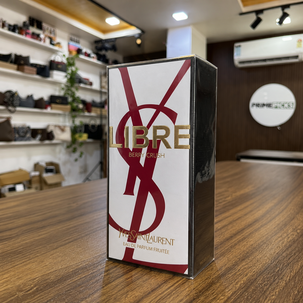 YSL Libre Berry Crush sealed perfume box lifestyle view